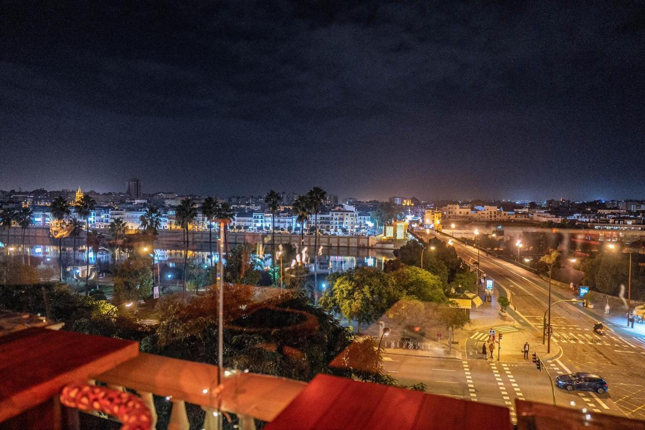 Hotel Lobby Sevilla Bagian luar foto Rabat at night