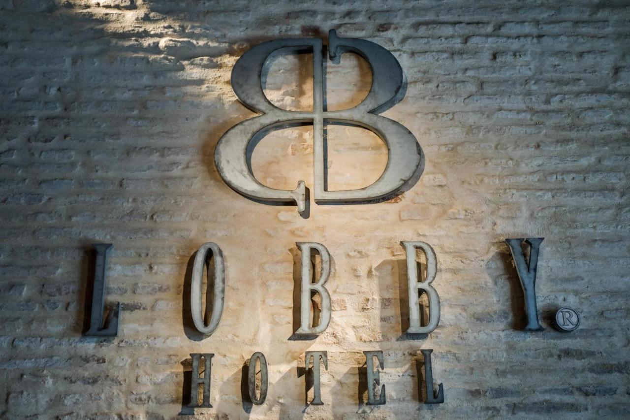 Hotel Lobby Sevilla Bagian luar foto The logo of the 88th Fighter Group